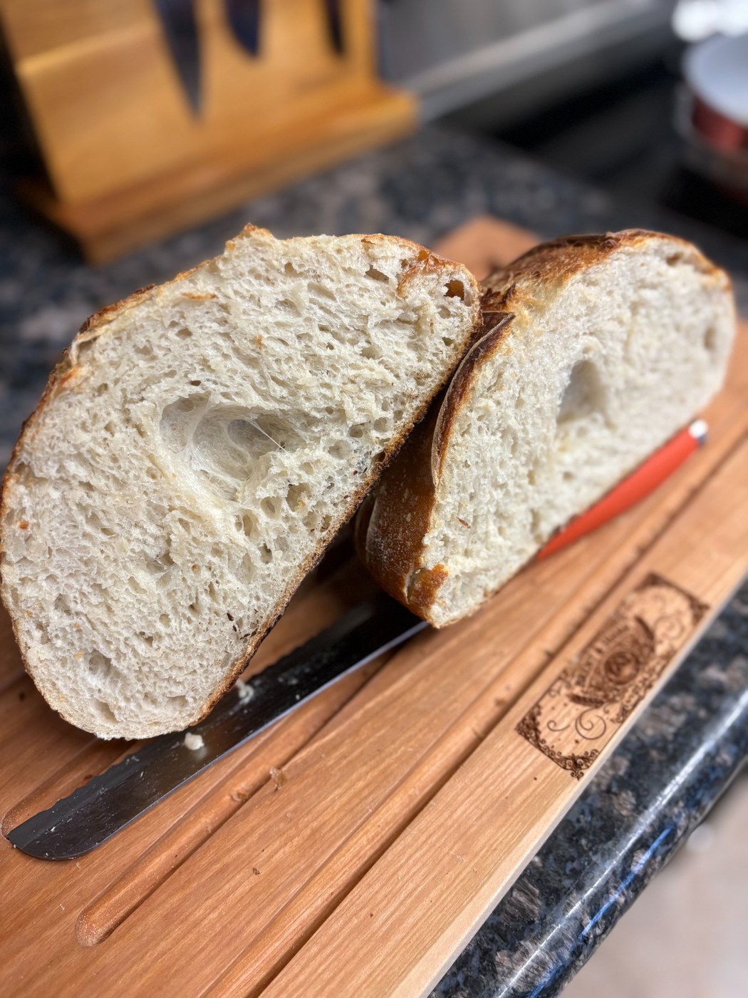 Sliced sourdough bread on a wooden board