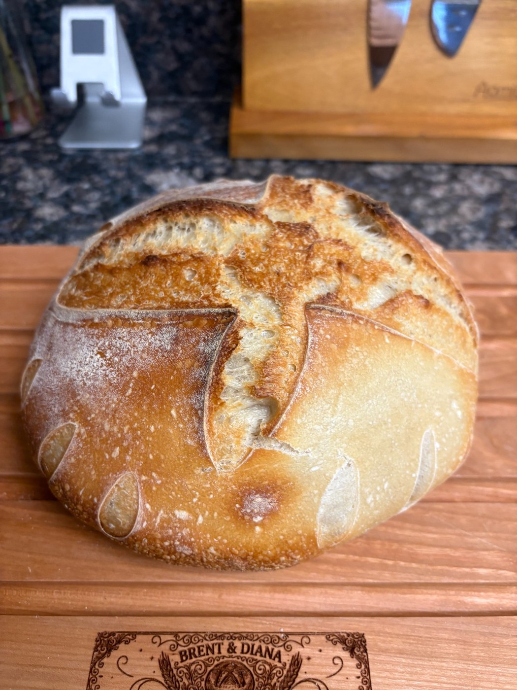 Round sourdough loaf on a wooden board