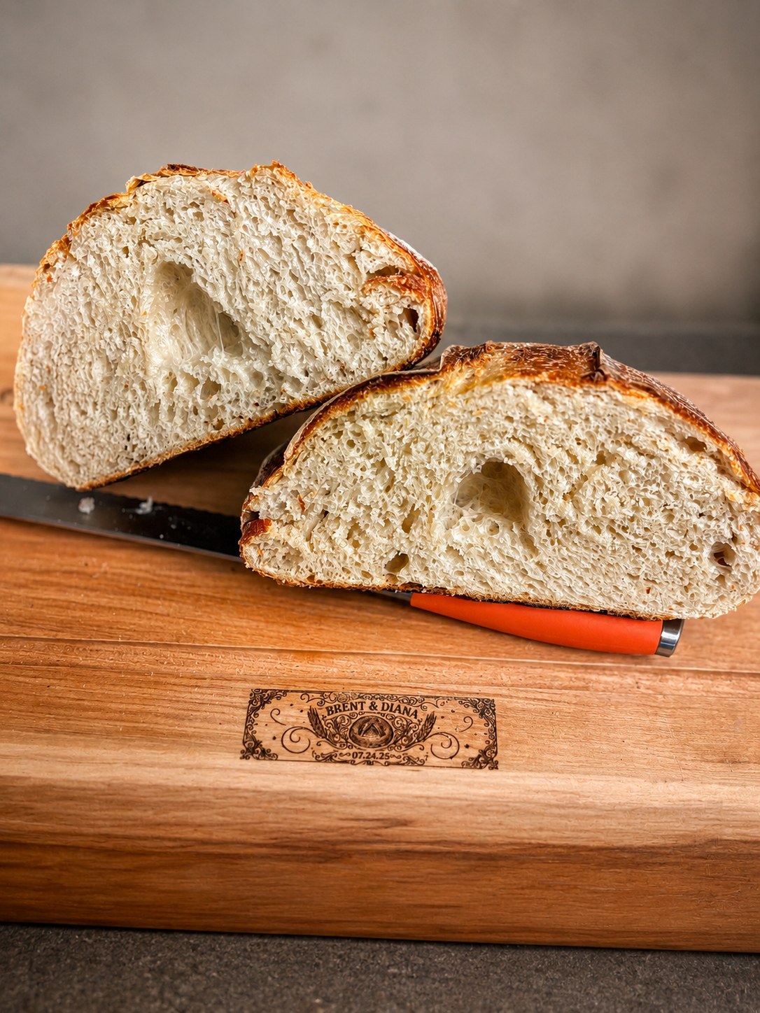 Fresh sliced sourdough bread on a wooden board